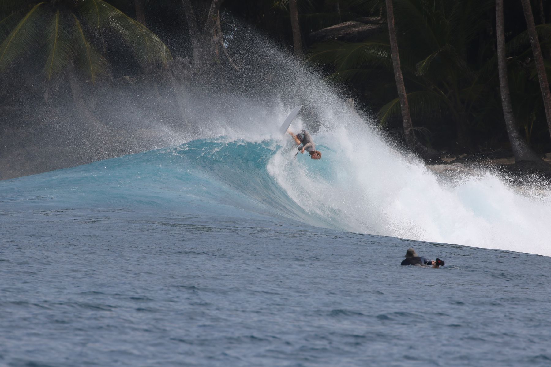 Surfer catching air above the lip near Hollow Tree's