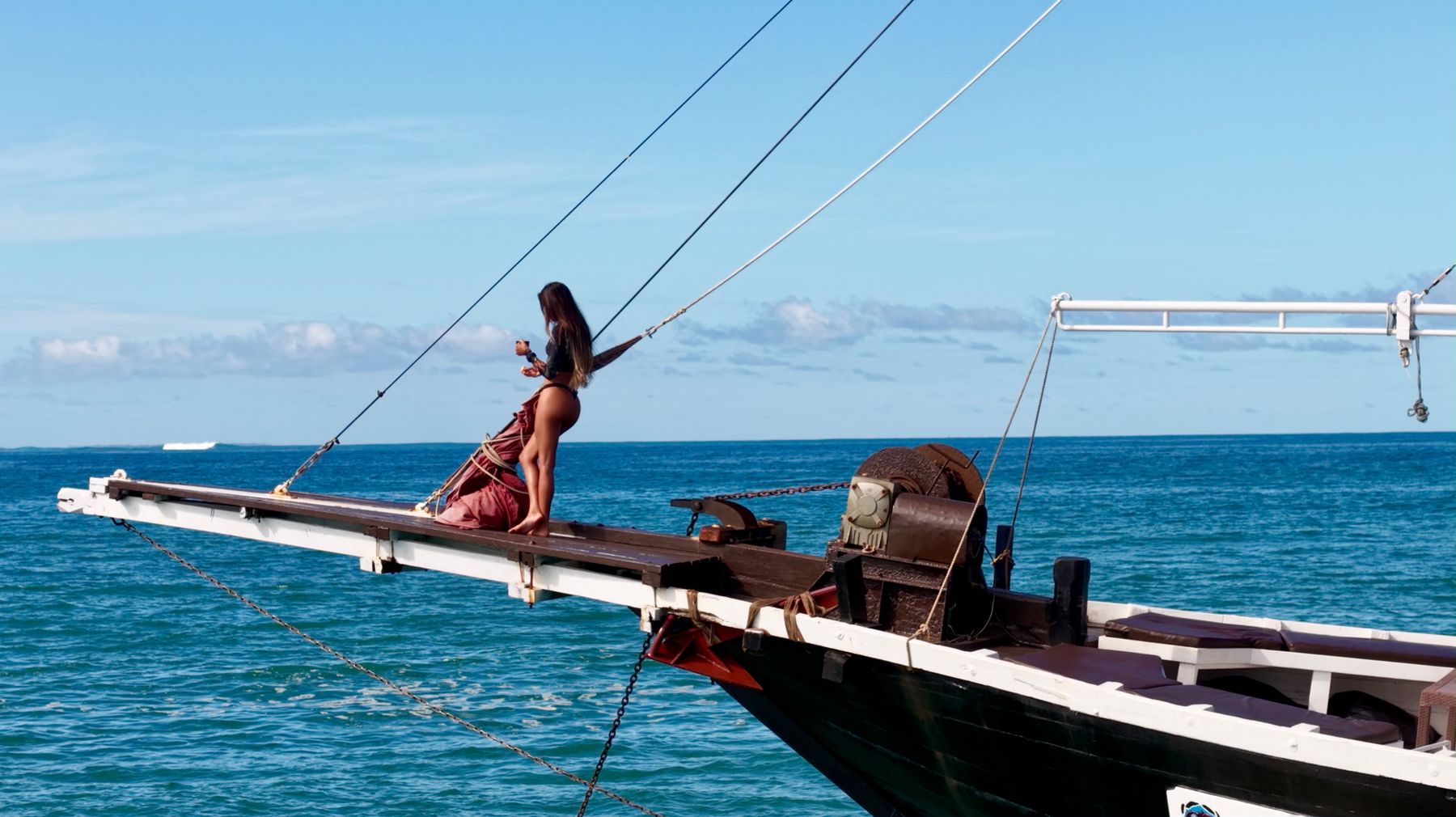 Guest on Maki's bowsprit, open ocean behind