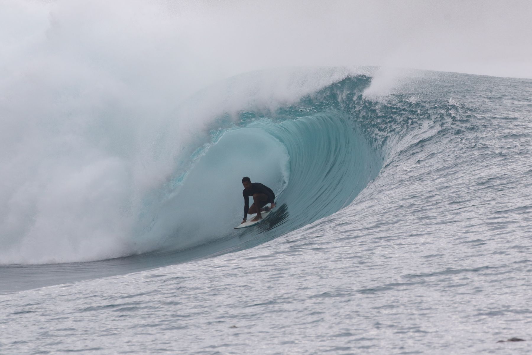 Surfer riding deep inside a Greenbush barrel